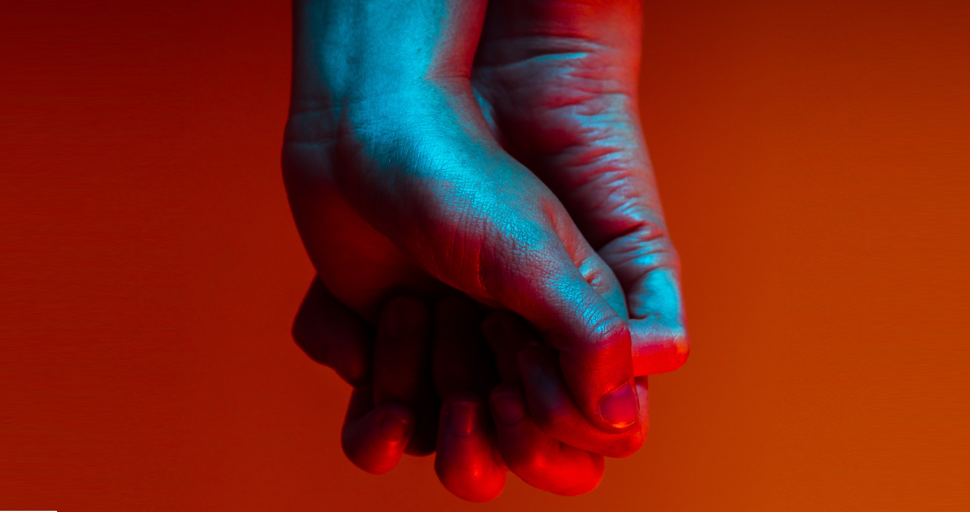 Image of two hands clasping each other